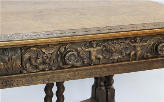 A 17th century style Flemish carved oak library table, W.6ft